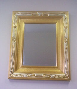 Art Nouveau style carved basswood frame and liner, gilded in white and yellow gold leaf